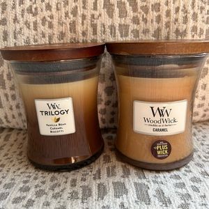 2 trilogy candles  1 Carmel and 1 vanilla bean caramel biscotti